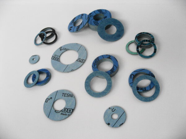 Compressed Fibre Washers blue washers on a white background